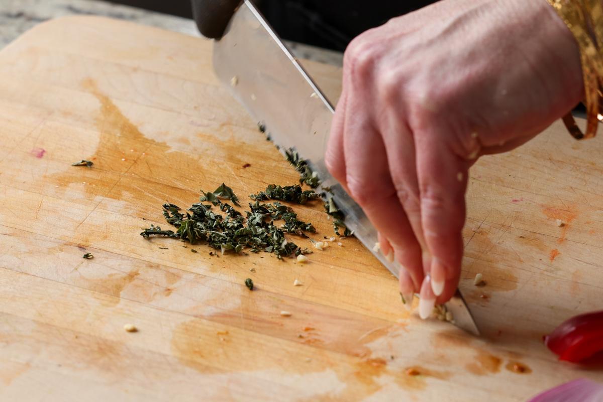 mincing the basil