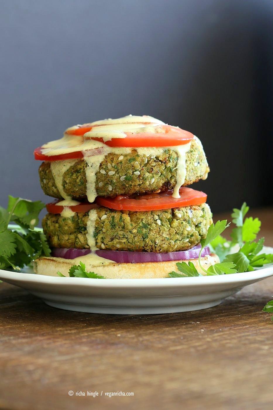 Easy Vegan Falafel Burger. Chickpea patties with tahini dressing and hummus make for a filling and flavorful burger. Vegan Soy-free Recipe. Can be made gluten-free | VeganRicha.com