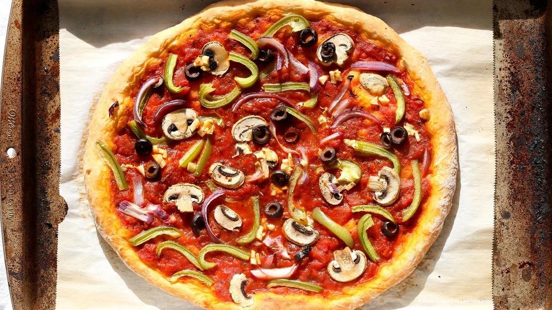 Easy Veggie Vegan Pizza with 20 minute Almost No Knead Crust! Pizza Sauce, Veggies, Mushrooms, Kalamata Olives baked to perfection. Dressed with Vegan Parmesan and fresh basil. Vegan Soy-free Recipe. Can be Nut-free | VeganRicha.com