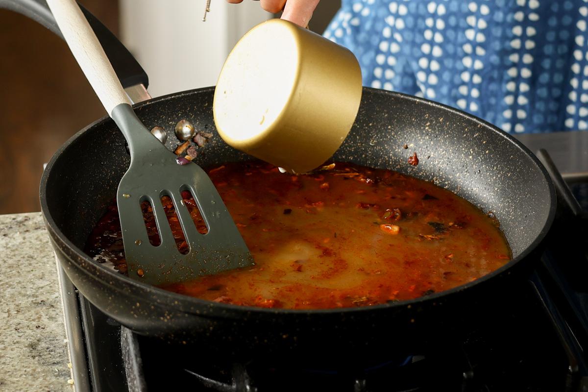 adding cornstarch slurry to the pan