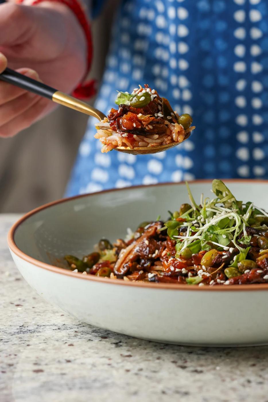 spoon taking a bite of crispy edamame bowl