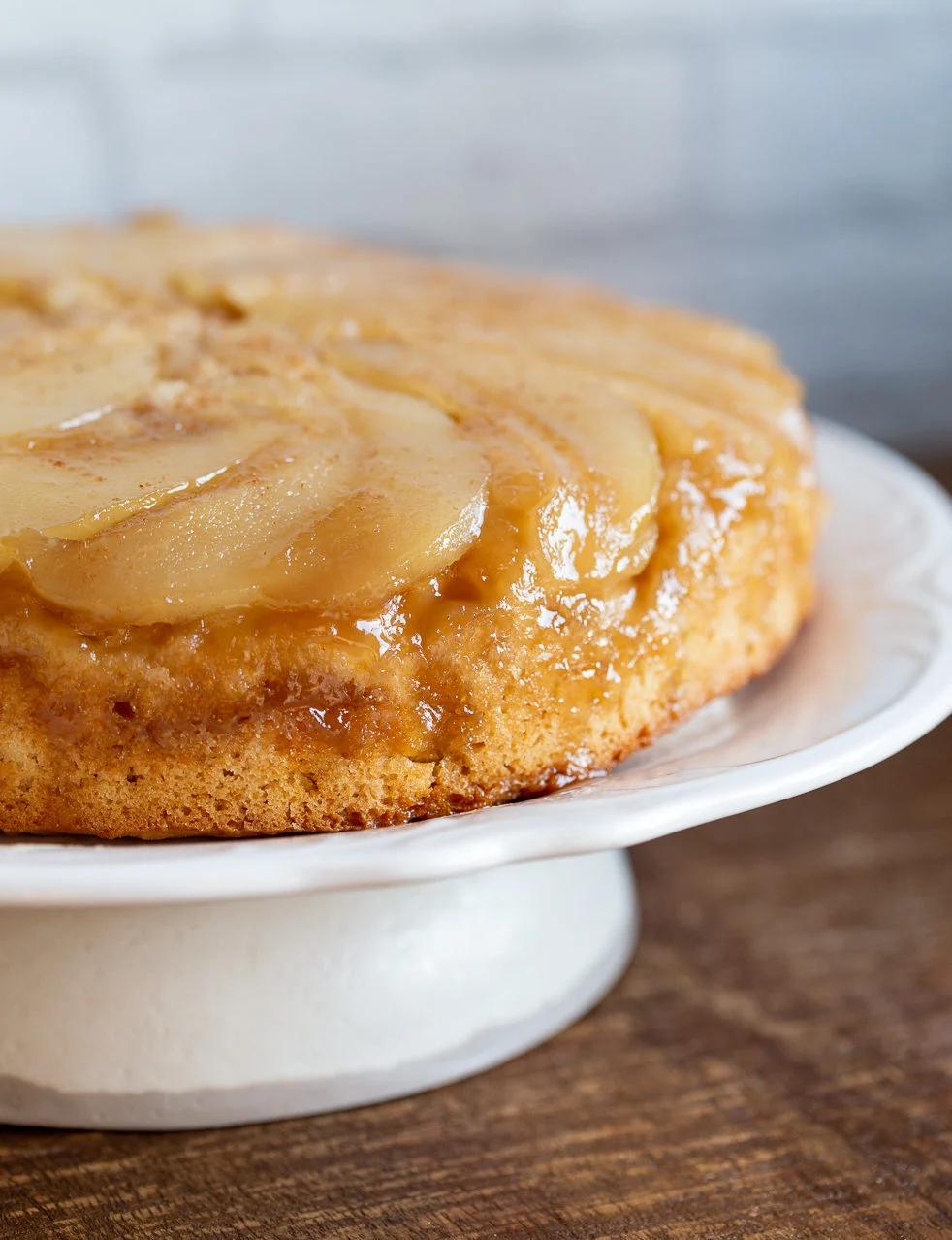 Pear Upside Down Cake on a cake stand