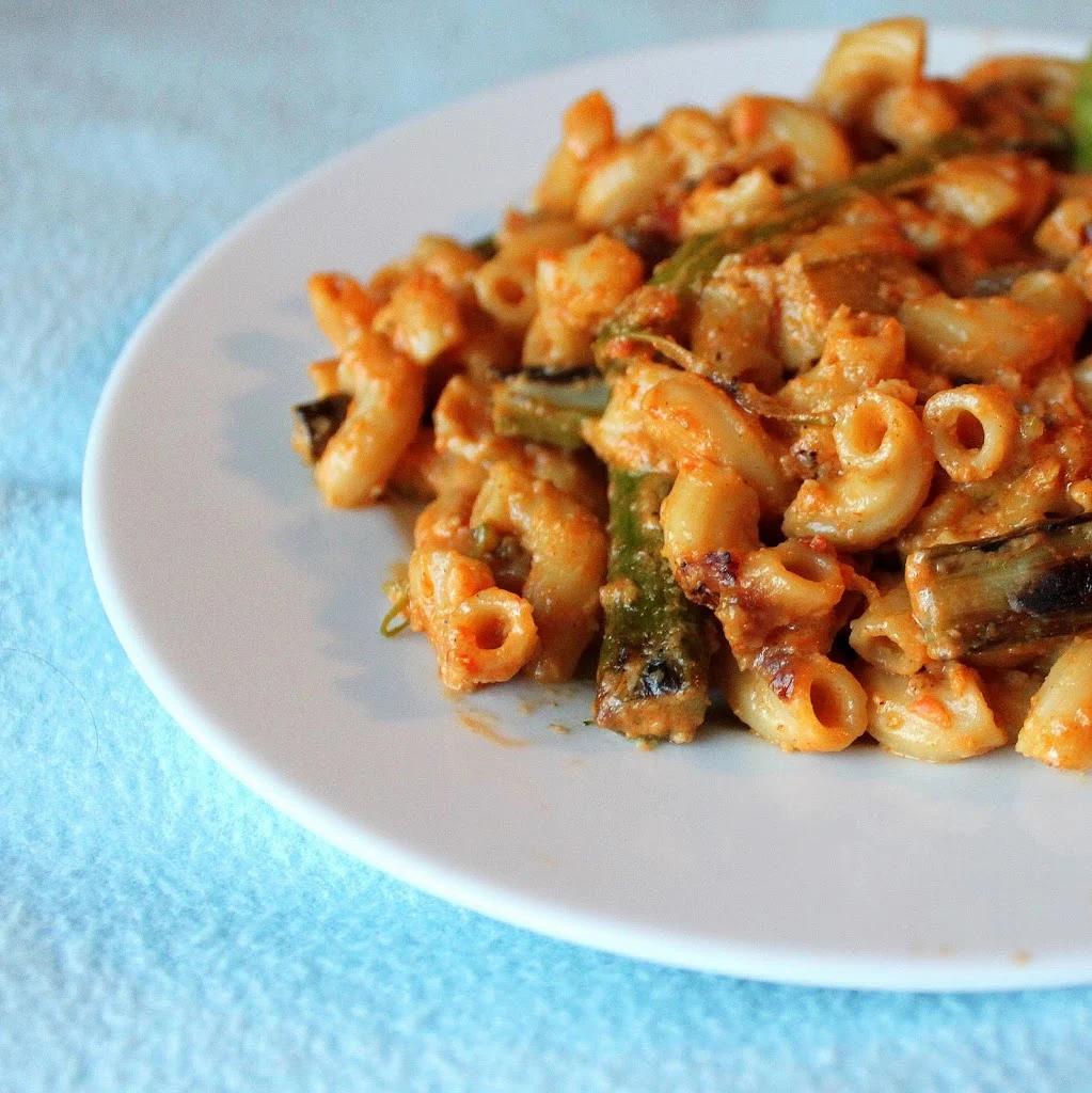 Elbows in Red pepper Alfredo with red onions and Asparagus! Vegan