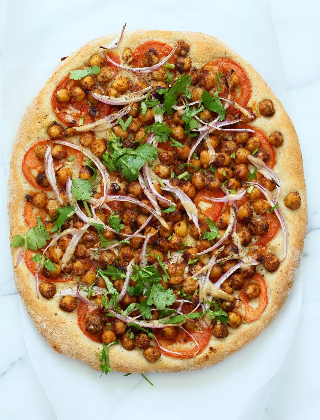 Ethiopian Berbere Chickpea Pizza with Tahini Garlic Dressing. Amazingly flavorful pizza. Dress with tahini dressing, vegan ranch or other creamy dressing. Vegan Soyfree Nut-free Recipe. Gluten-free Crust option. | VeganRicha.com