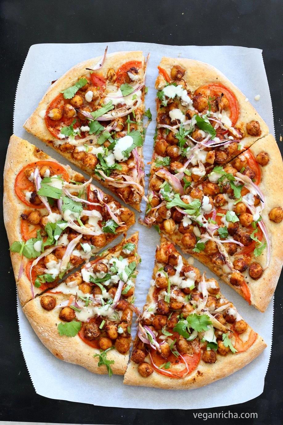 Ethiopian Berbere Chickpea Pizza with Tahini Garlic Dressing. Amazingly flavorful pizza. Dress with tahini dressing, vegan ranch or other creamy dressing. Vegan Soyfree Nut-free Recipe. Gluten-free Crust option. | VeganRicha.com
