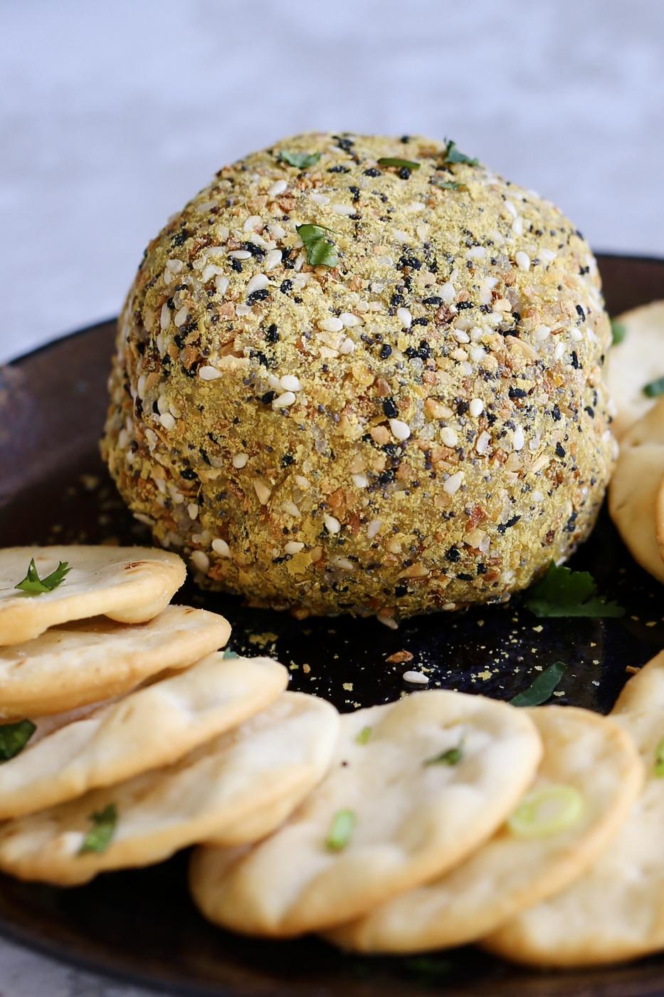 Side view of Everything bagel Seasoning coated Vegan Cheese Ball.” Everything Bagel vegan cheeseball. No soaking, blending, straining needed! 10 minute vegan cheese ball. Gluten-free. Can be soy-free #vegan #cheese #veganricha | VeganRicha.com