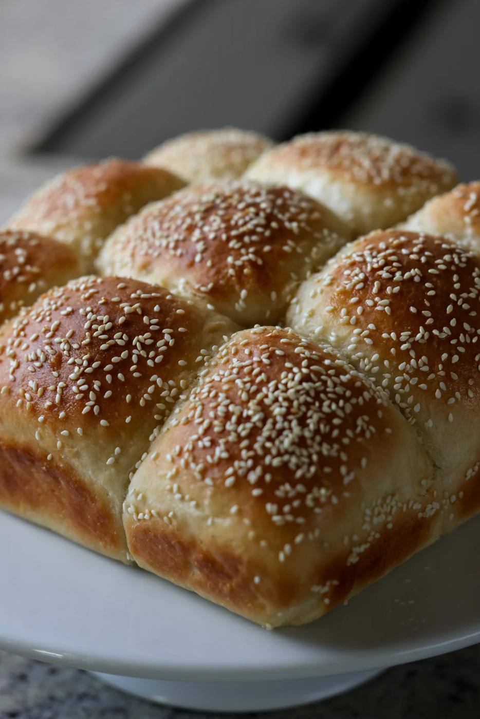 fluffy dinner rolls on a serving tray before pulling apart