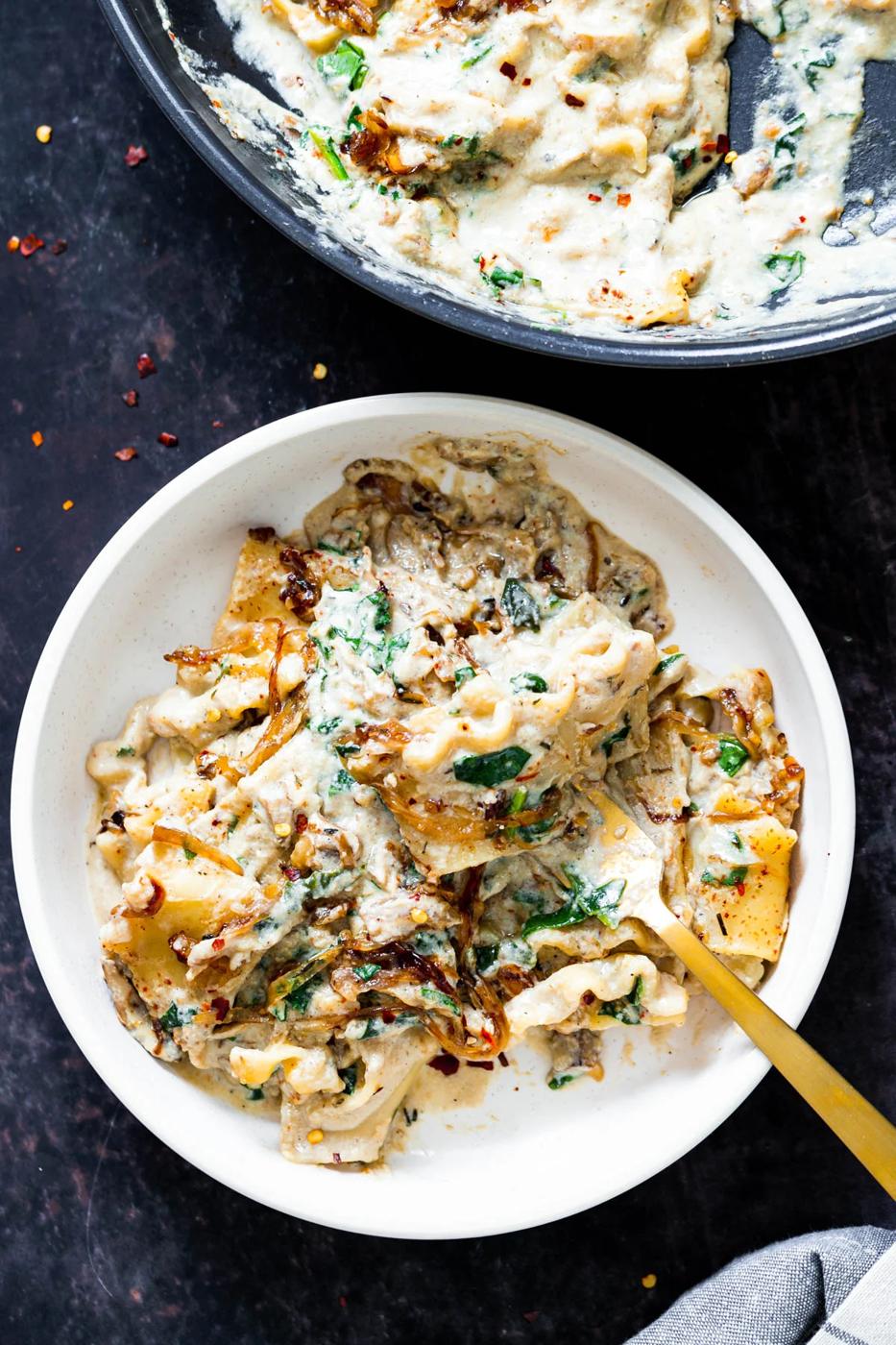 a bowl of vegan skillet lasagna with a golden fork