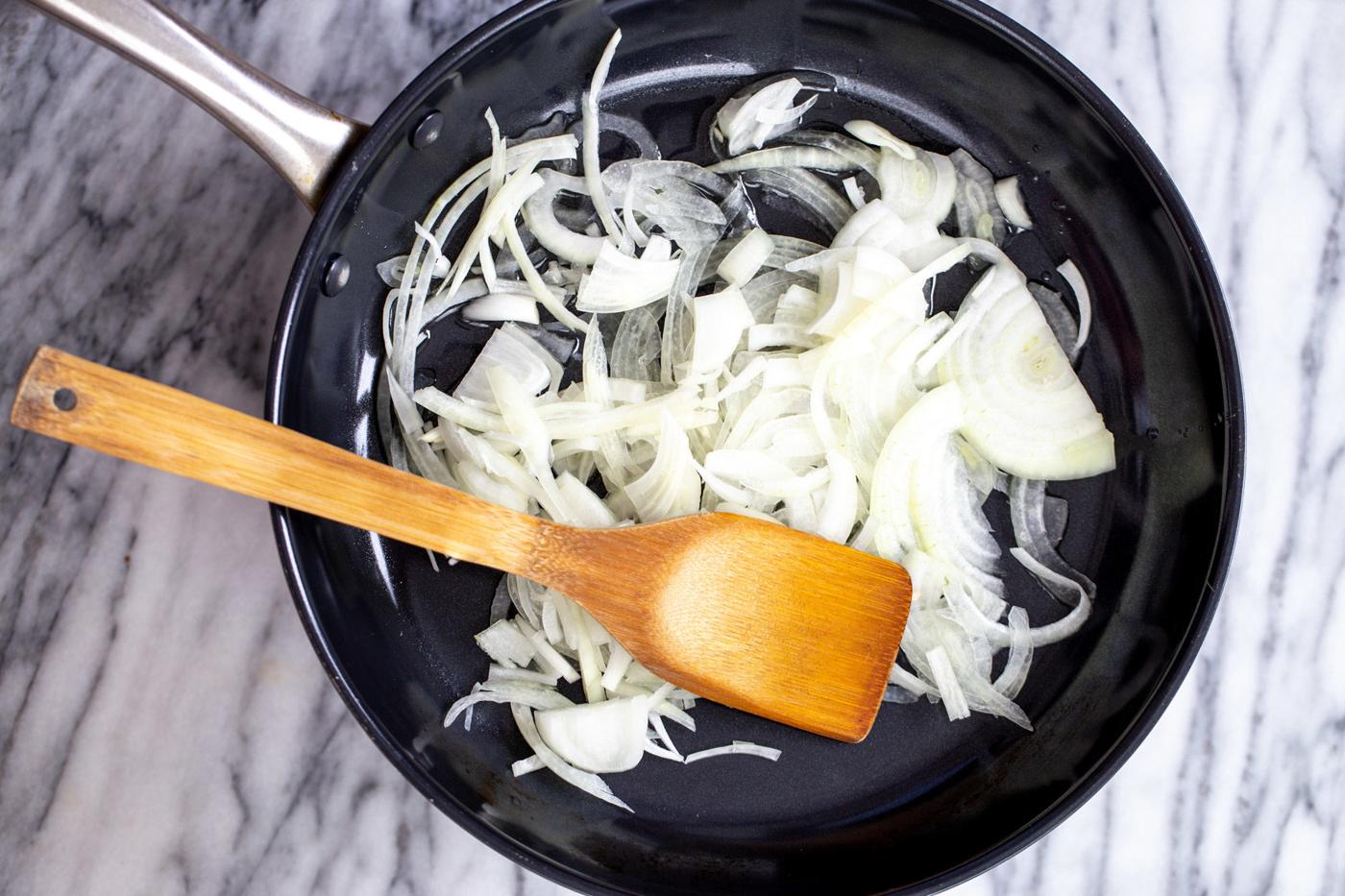 onion slices in a black skillet