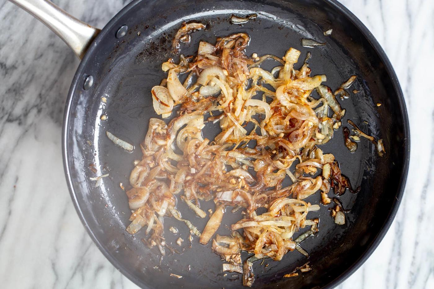 caramelized browned onion in a black skillet