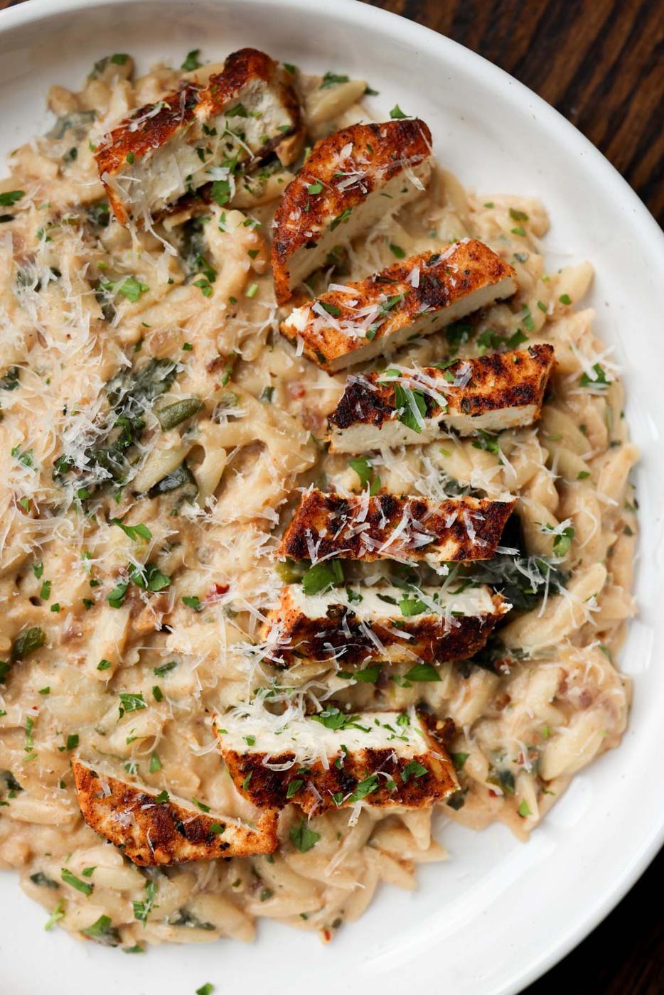 garlic parmesan orzo on a plate with the crispy tofu