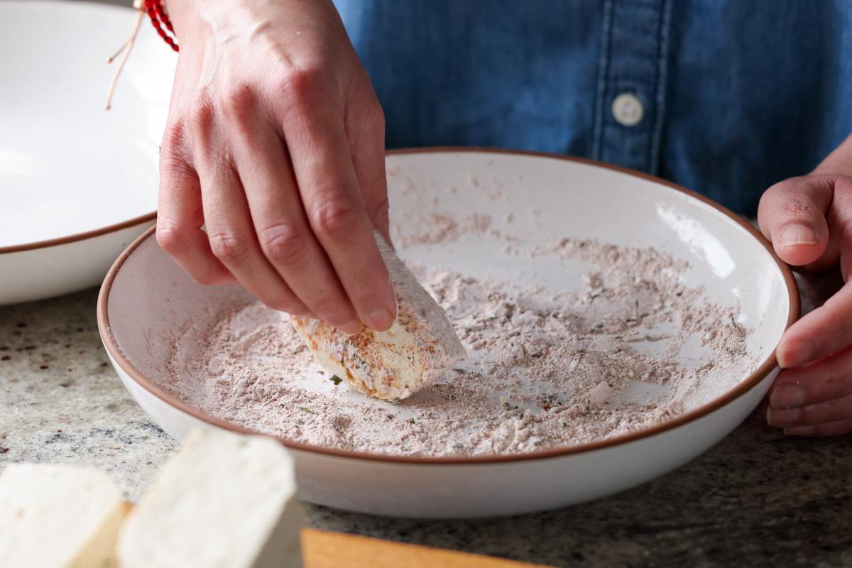 coating tofu in the cornstarch and spices