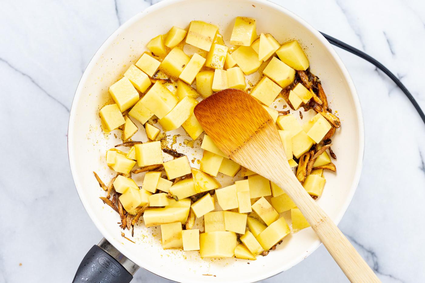 Potatoes in white skillet
