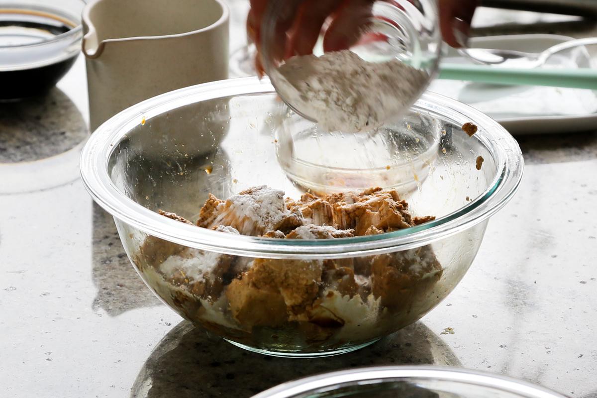 adding cornstarch to the tofu