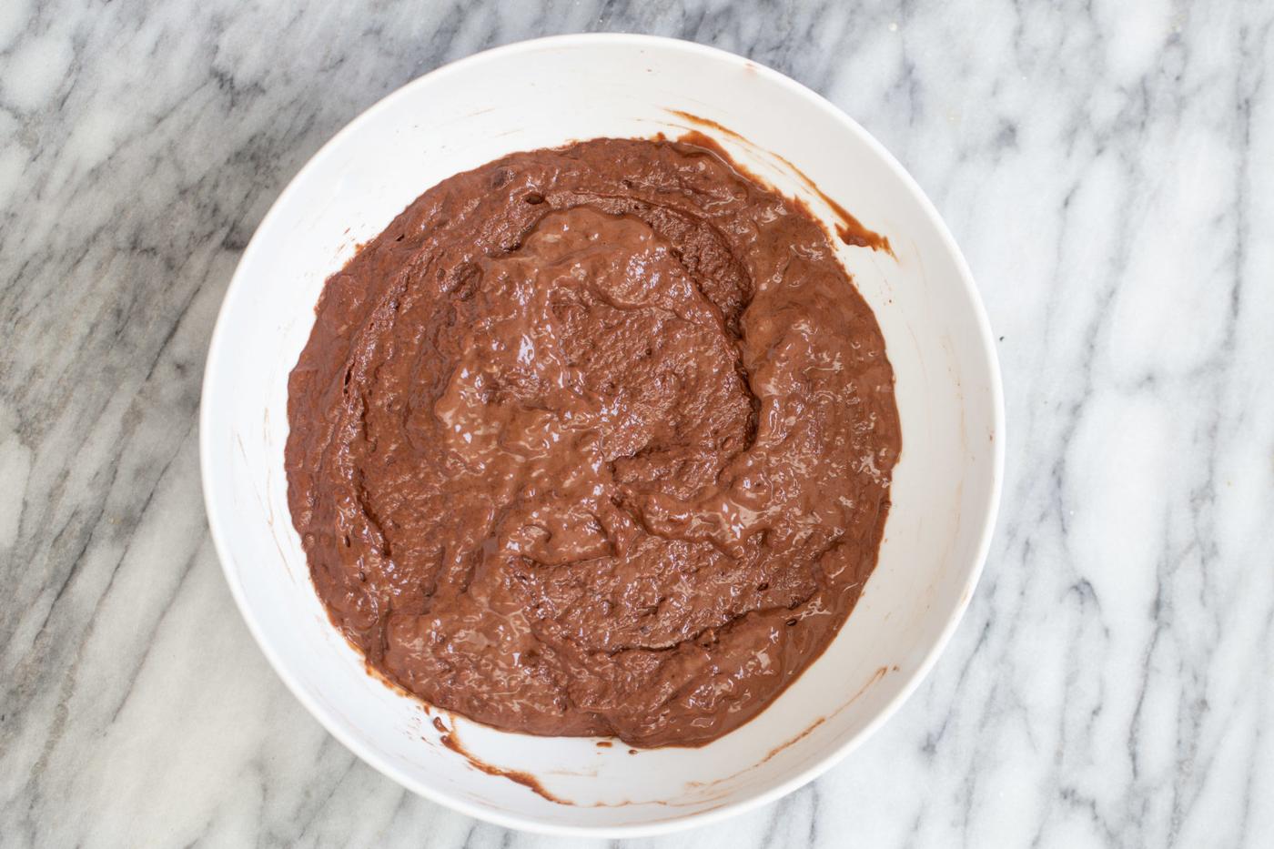 vegan german chocolate cake batter in a white bowl
