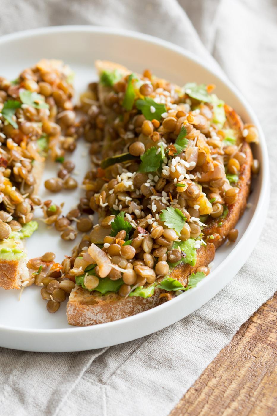 Ginger Coriander Sprouted Lentils Avocado Toast. Sprout Lentils or Mung Beans, Lightly saute with ginger, onion and tomato and serve over Mashed Avocado Toast. #Vegan #veganricha #Nutfree #Soyfree #Recipe | VeganRicha.com