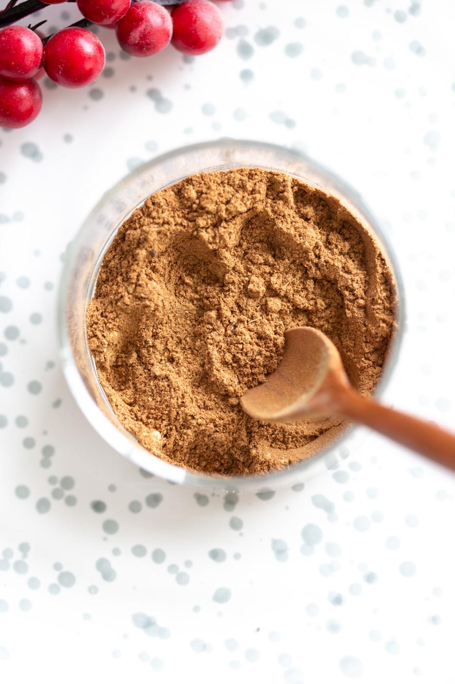 Homemade Gingerbread Spice Mix in a glass bowl on white stoneware