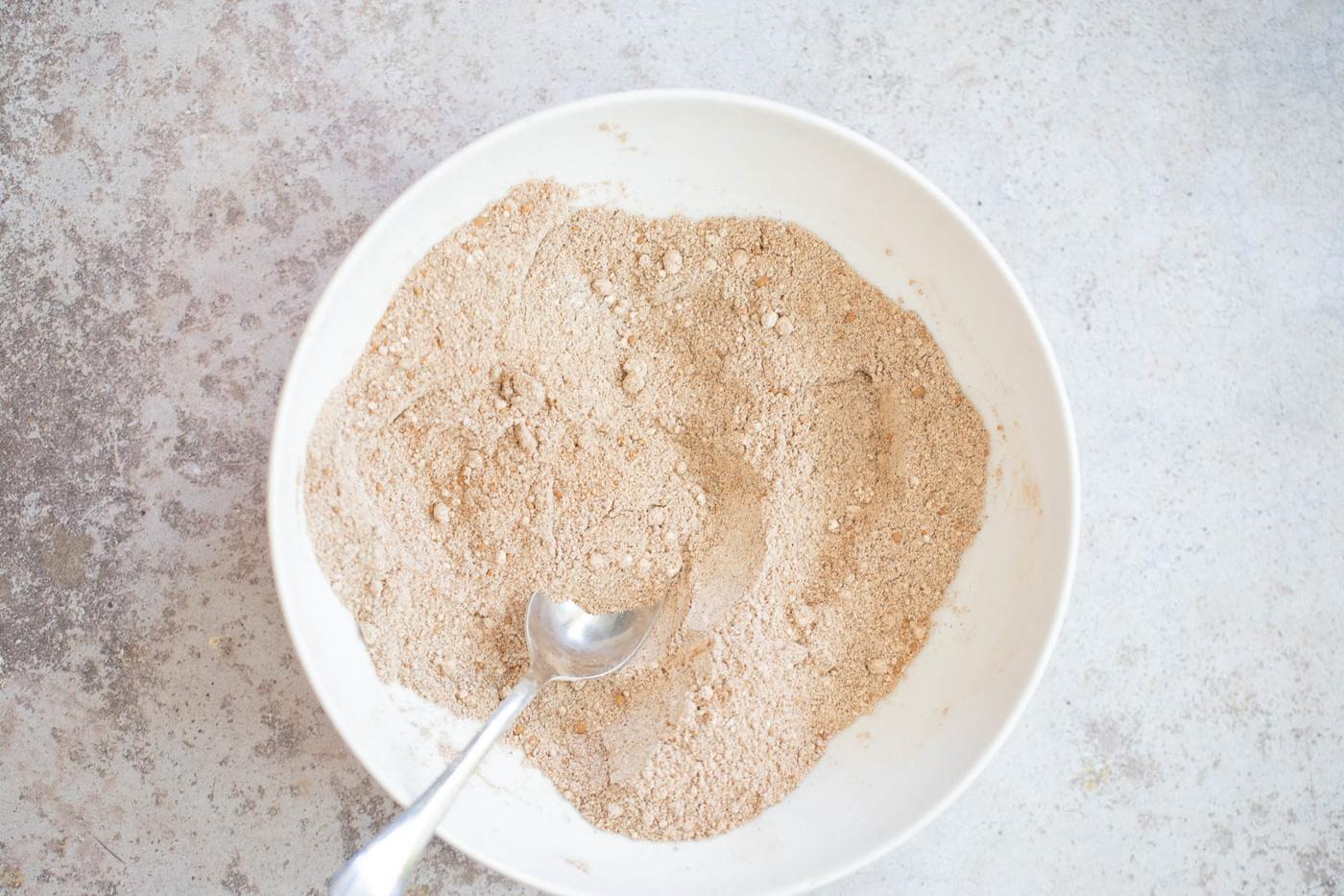 dry ingredients for glutenfree buckwheat waffles in a white bowl