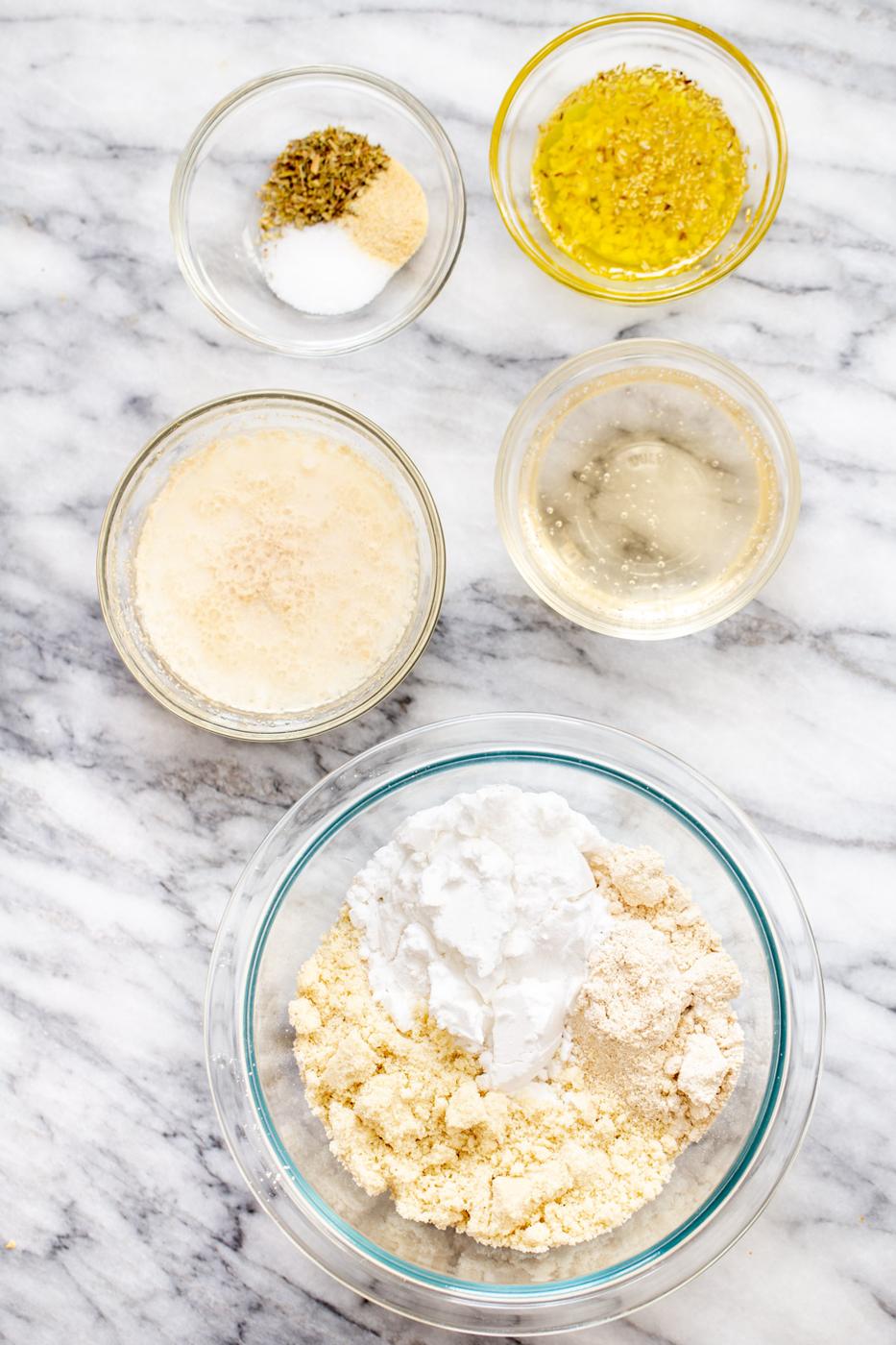 ingredients for glutenfree focaccia on a marble counter