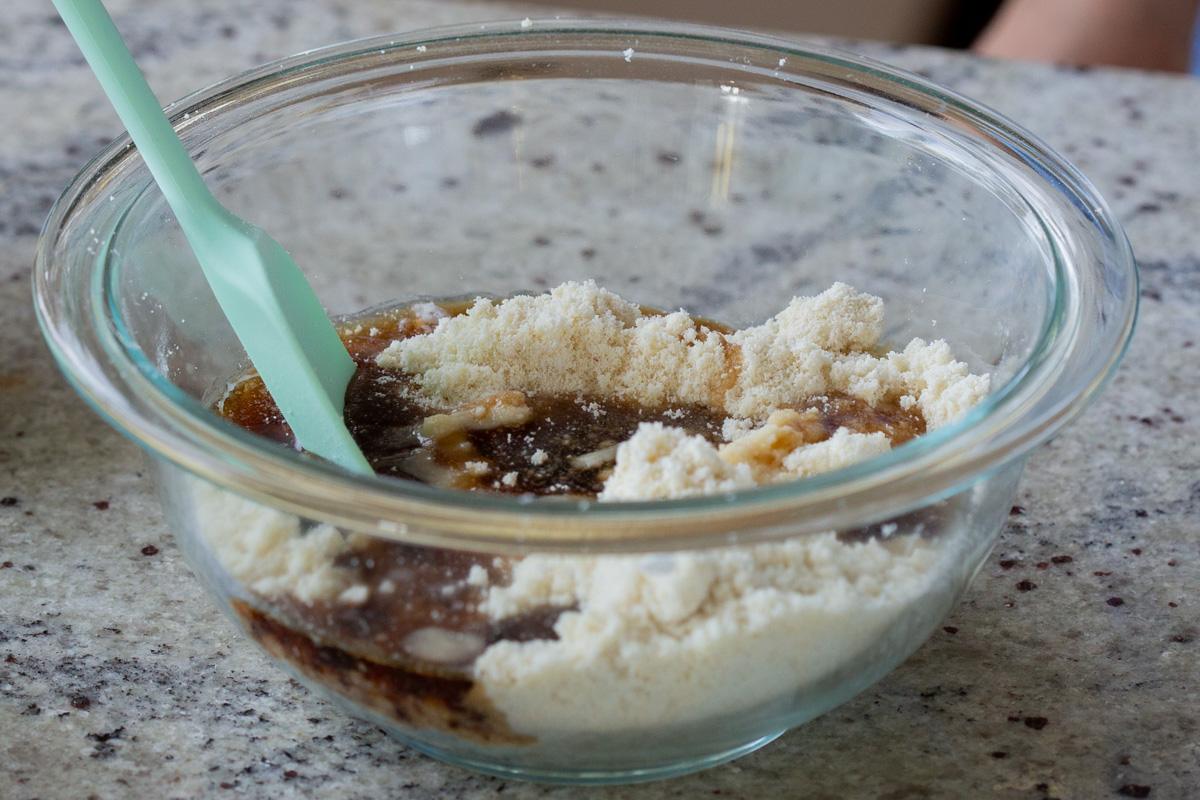 adding wet ingredients to the dry
