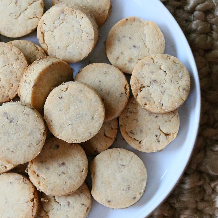 overhead shot of gluten-free vegan sugar cookies on a white cookie platter