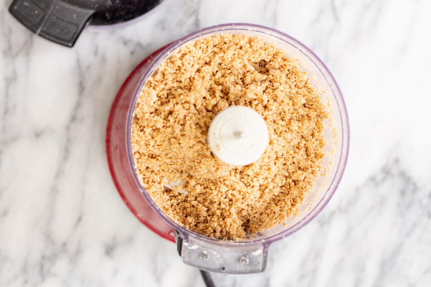 ingredients for vegan glutenfree pie crust in a food processor