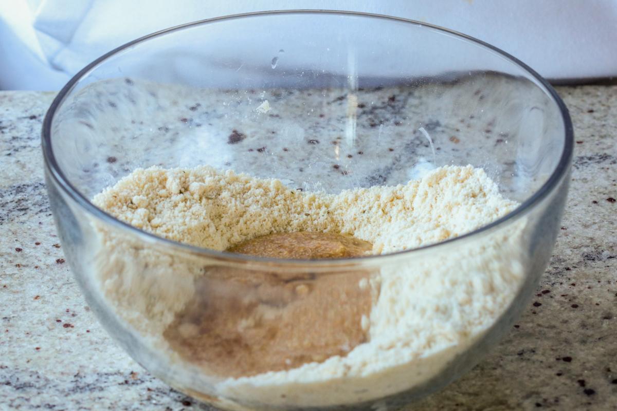 adding wet ingredients to the bowl
