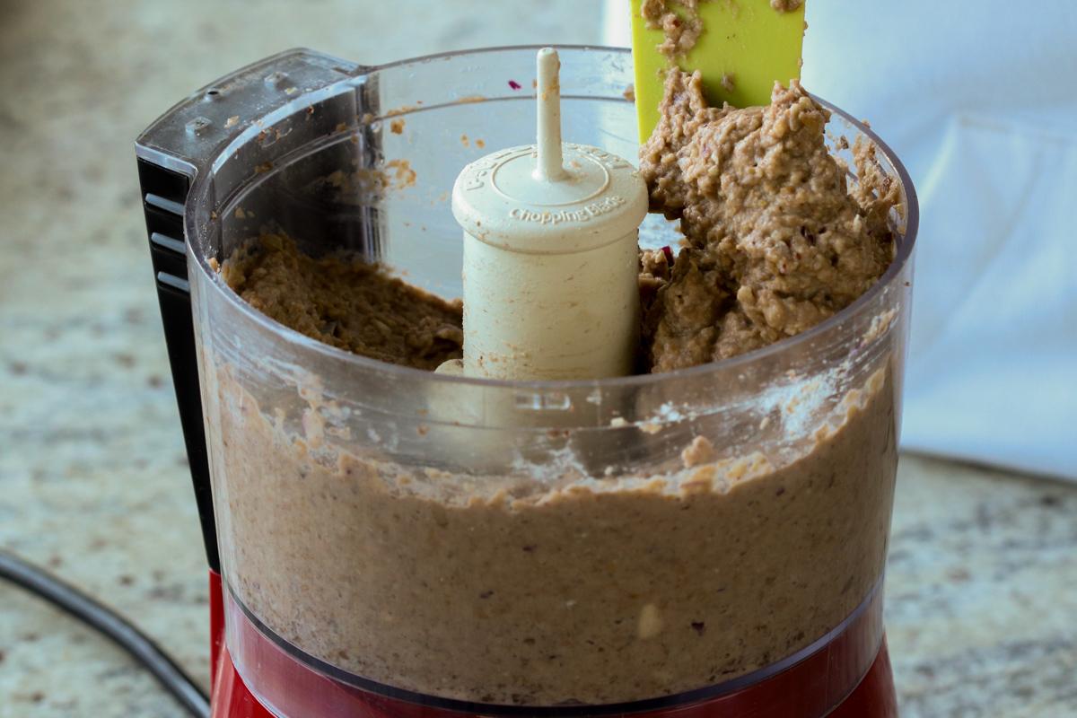 spoon scraping up the lentil mixture to show the texture