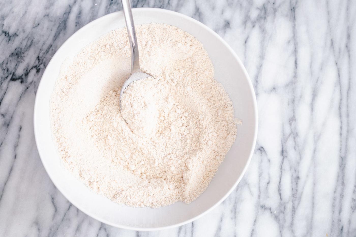 dry mix for making glutenfree vanilla donuts in a white bowl