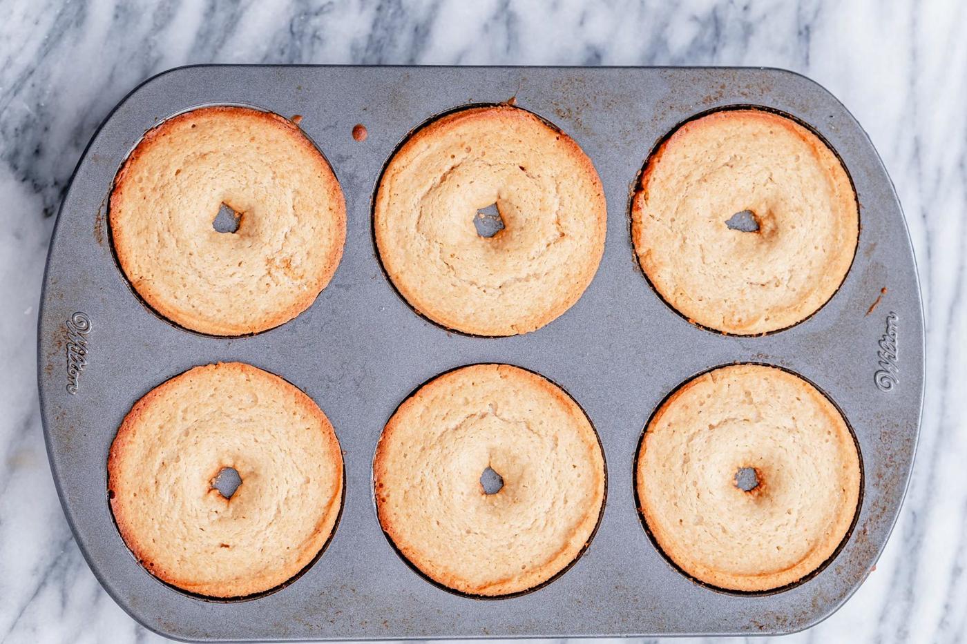 freshly baked glutenfree donuts in a baking pan