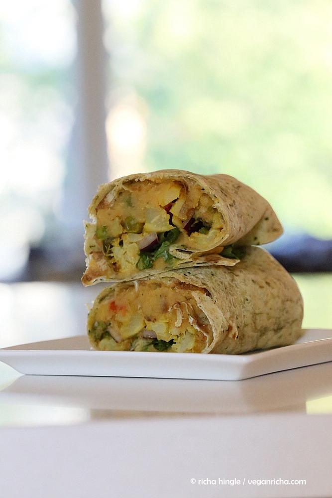 a cut and stacked vegan red lentil hummus wrap with cauliflower and broccoli