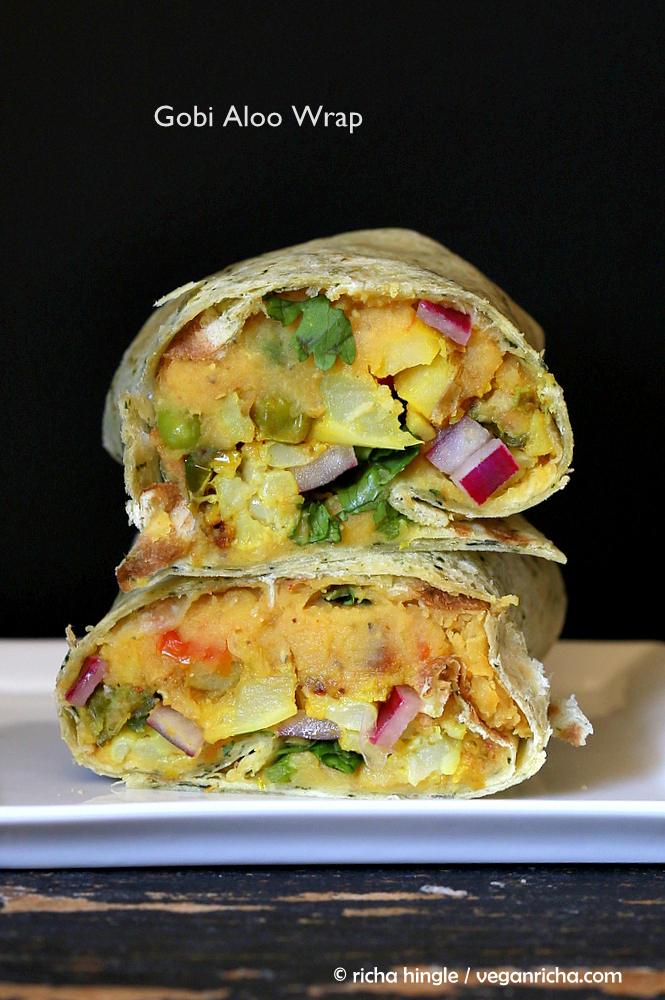 stacked vegan red lentil hummus wraps with pickled onions, potatoes and cauliflower