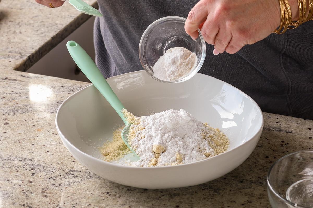 adding dry ingredients to the bowl