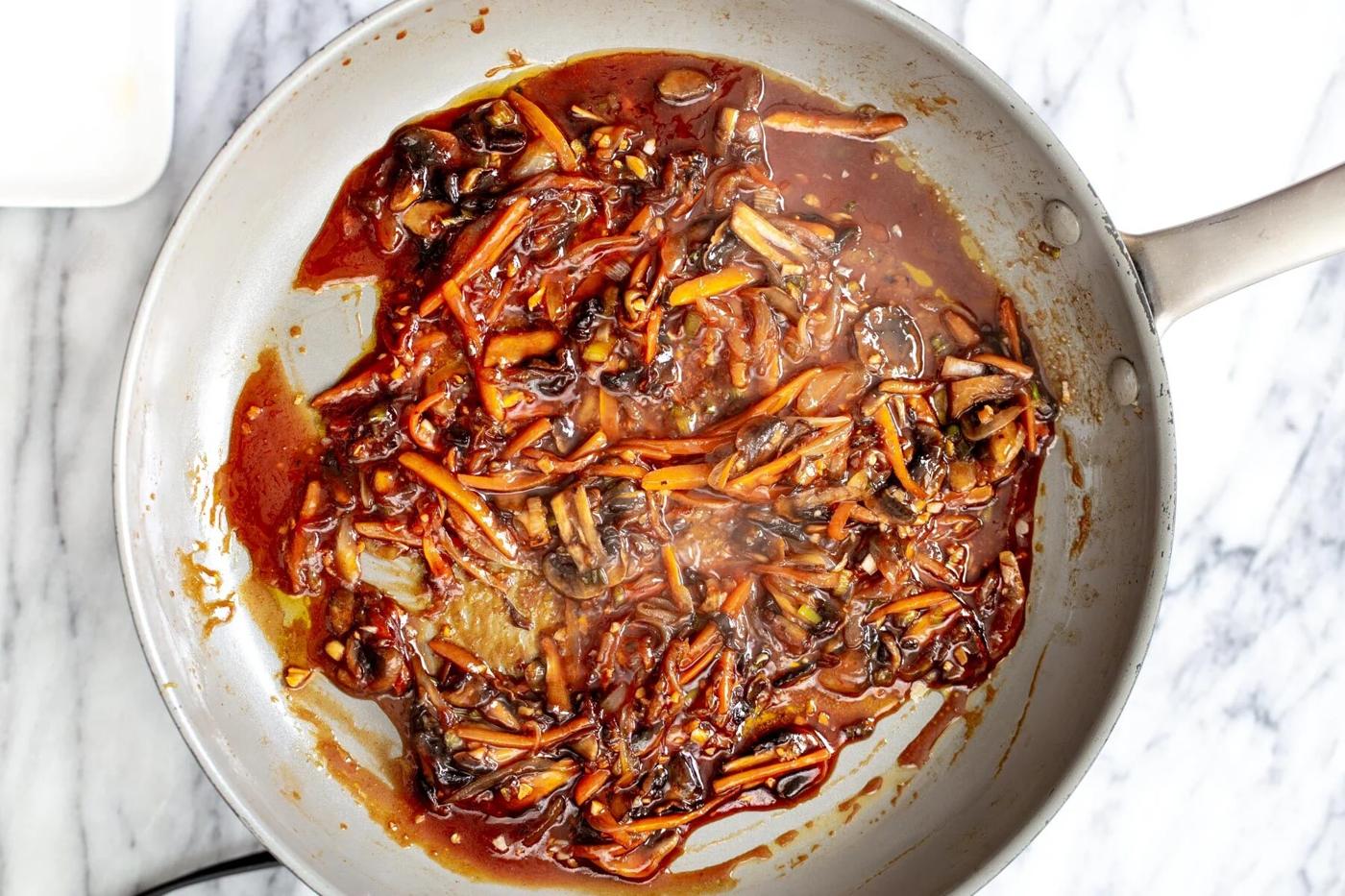 veggies in a saucepan simmering with sauce ingredients