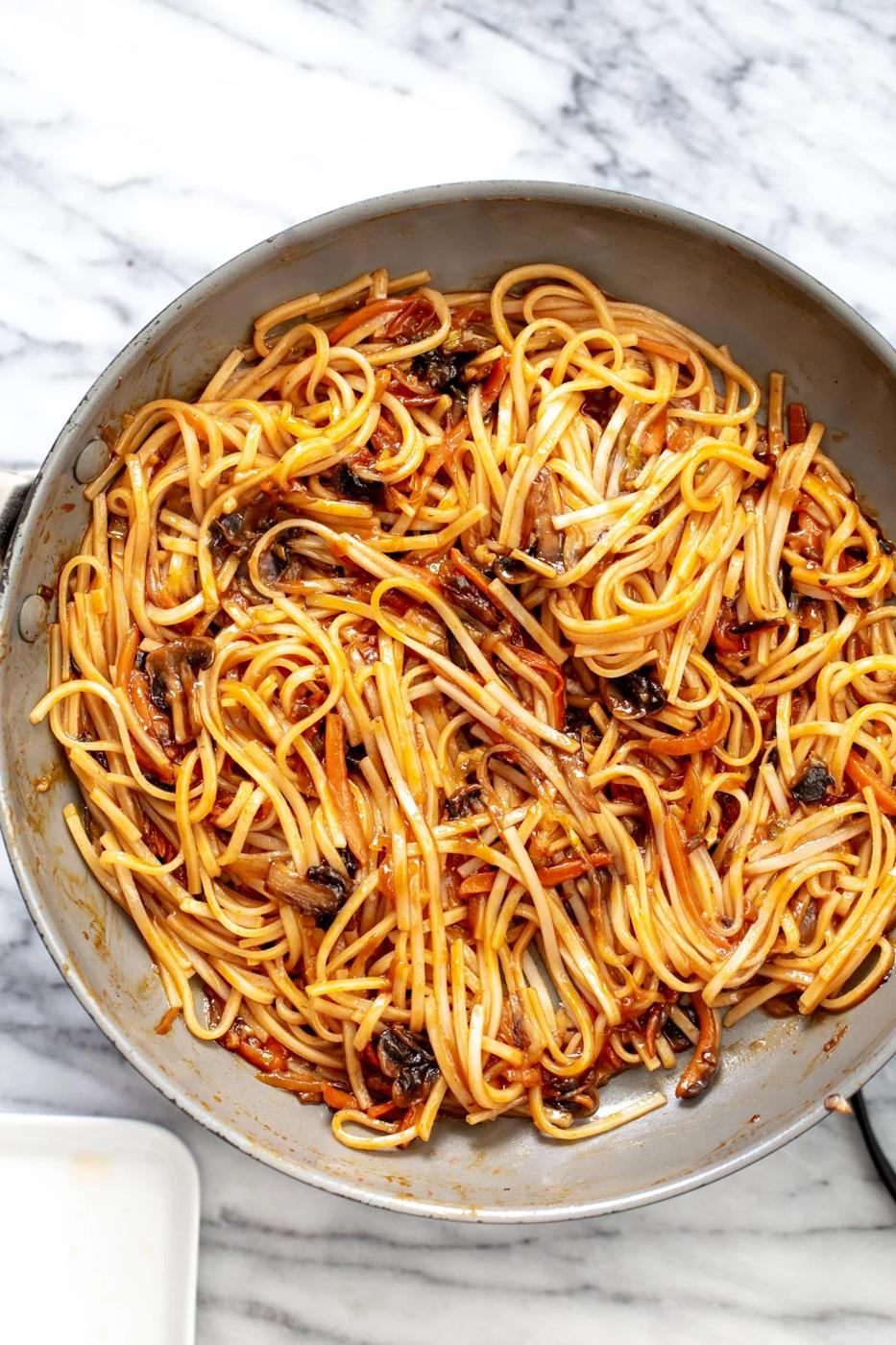 Vegan Korean gochujang noodles in a saucepan