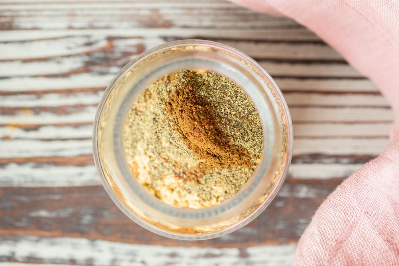 Cardamom, cinnamon, cloves, turmeric for our Golden Chai Mix in a glass container