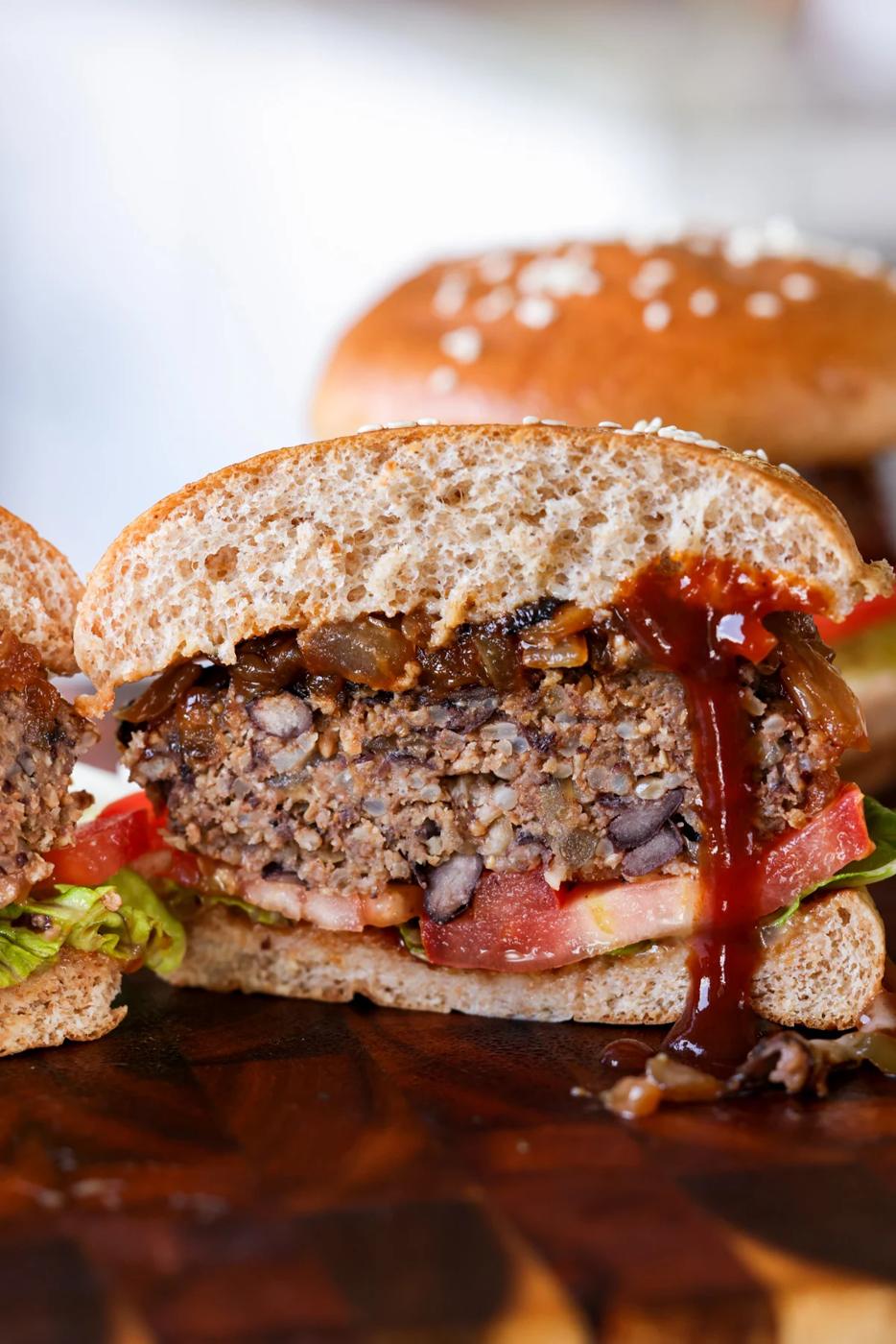 Black bean sunflower seed burger cut in half.