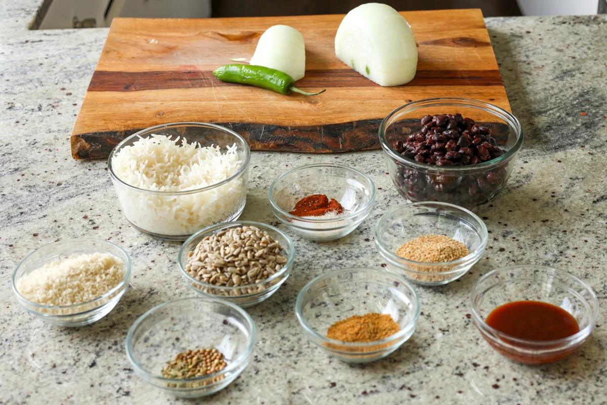 Ingredients used to make black bean burger in glass bowls.