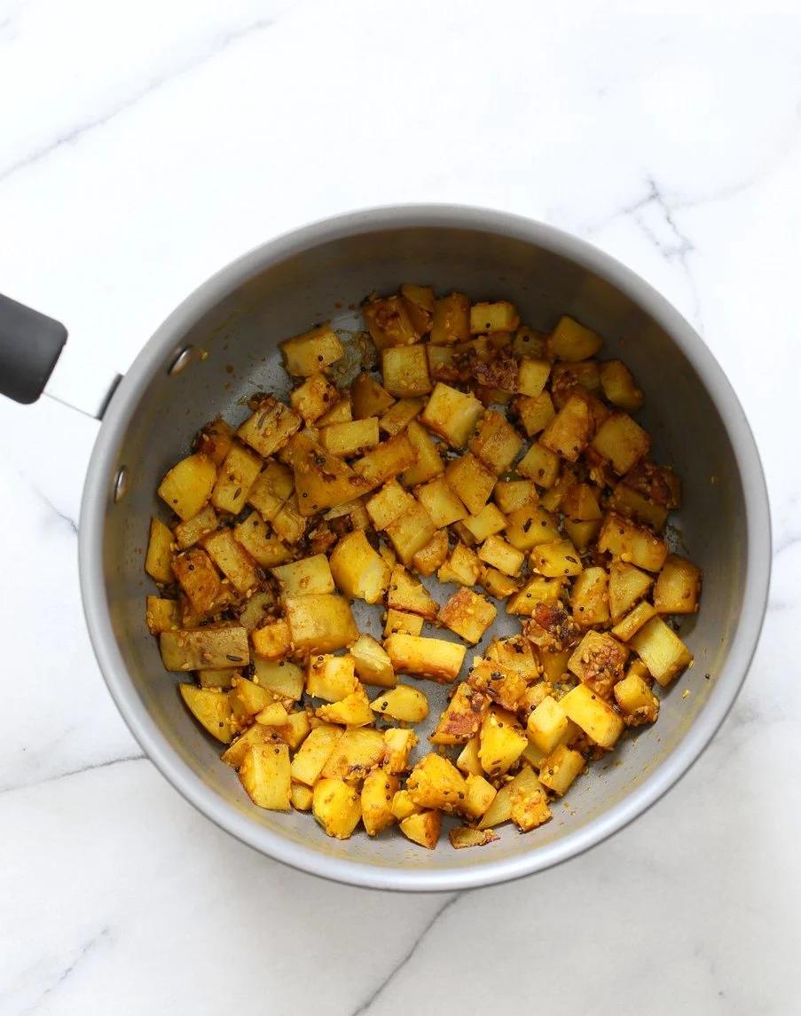 Gujarati Potatoes with Sesame Seeds. Indian Spiced Potatoes with sesame seed and peanuts. Vegan Gluten-free Soy-free Indian Gujarati Recipe. Bateta Nu Shaak | VeganRicha.com