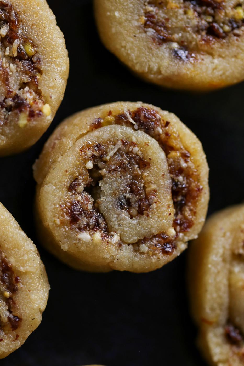 close-up of gujiya peda on a dark brown plate