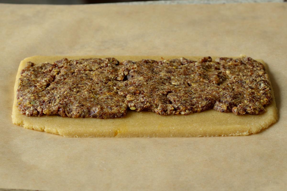 peda dough after rolling out with gujiya mixture on top