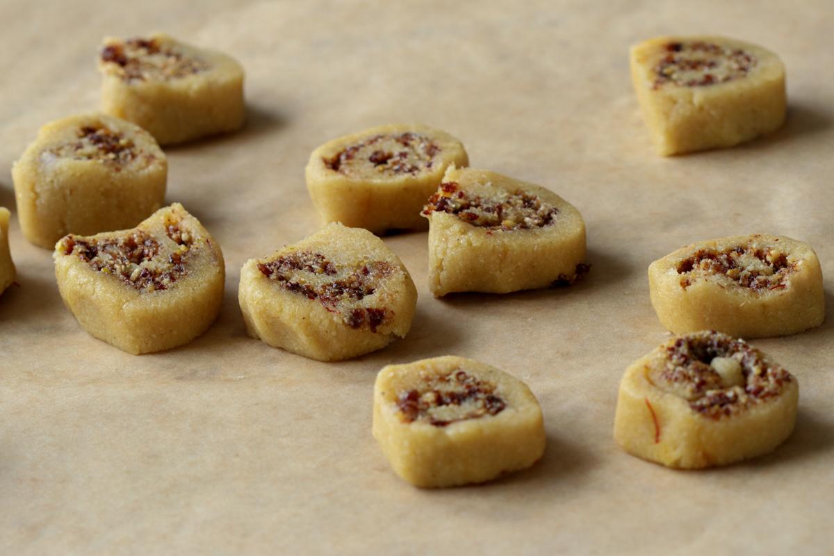 sliced gujiya peda on a piece of parchment paper