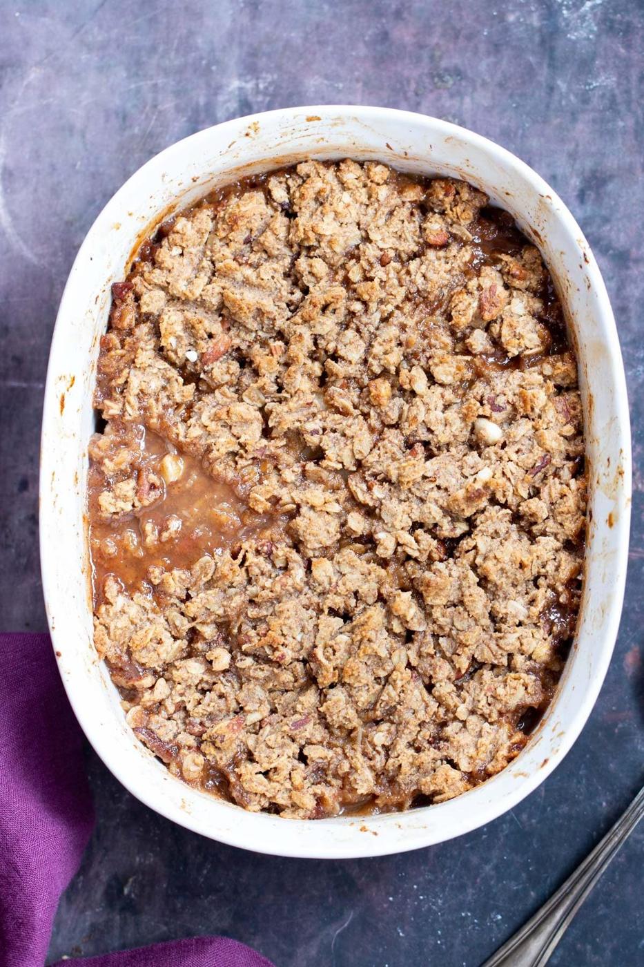 freshly baked apple pear crisp in a white casserole dish