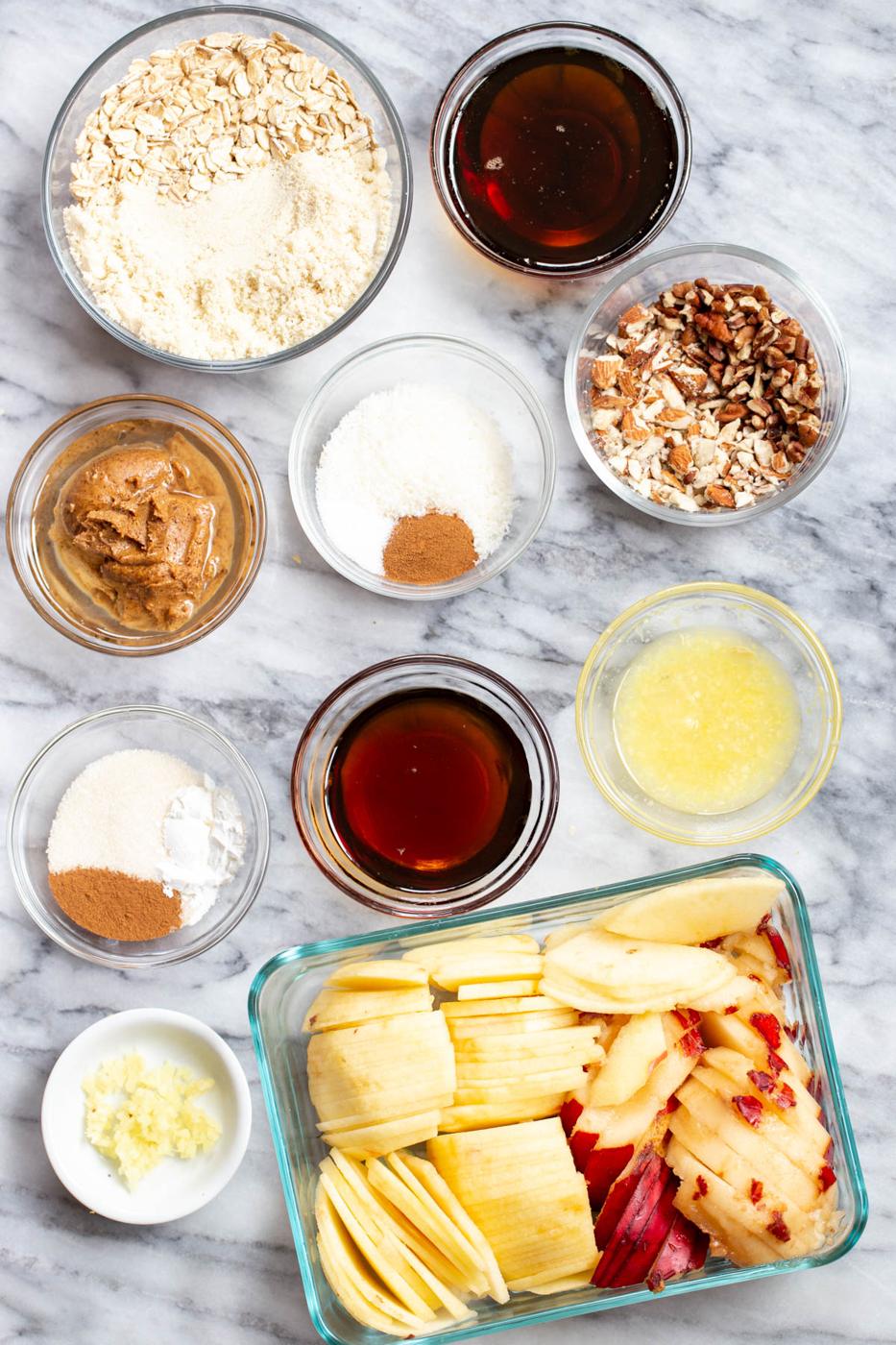 ingredients needed for making apple pear crisp on a marble counter