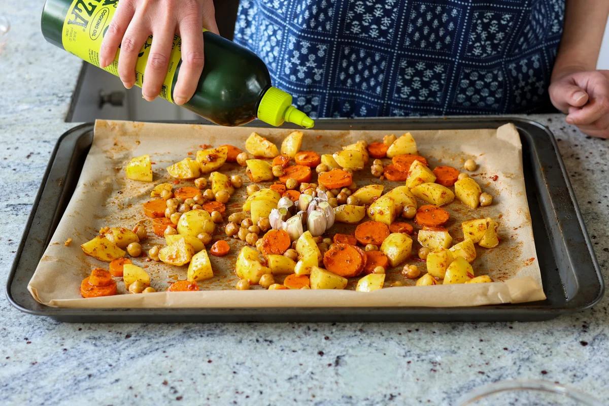 adding oil to the veggies before roasting