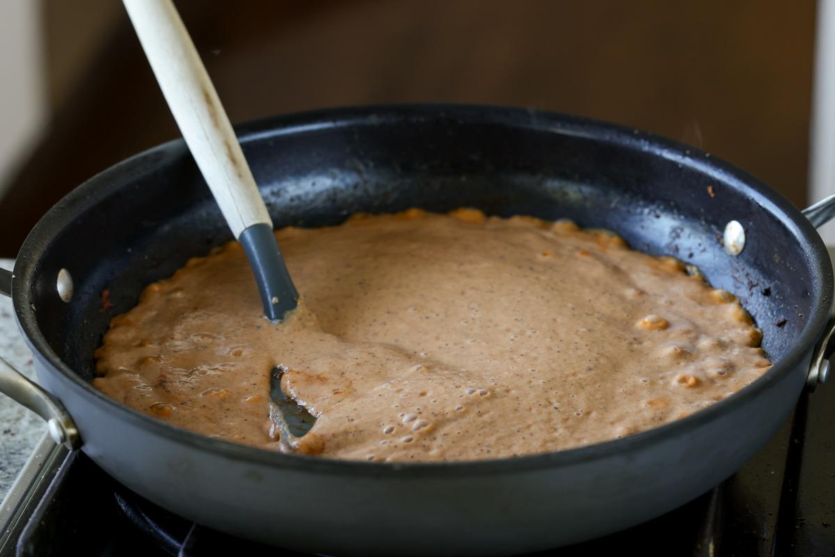 bringing the sauce to a boil