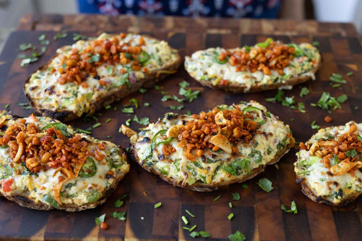 Indian chilli cheese toasts on a cutting board