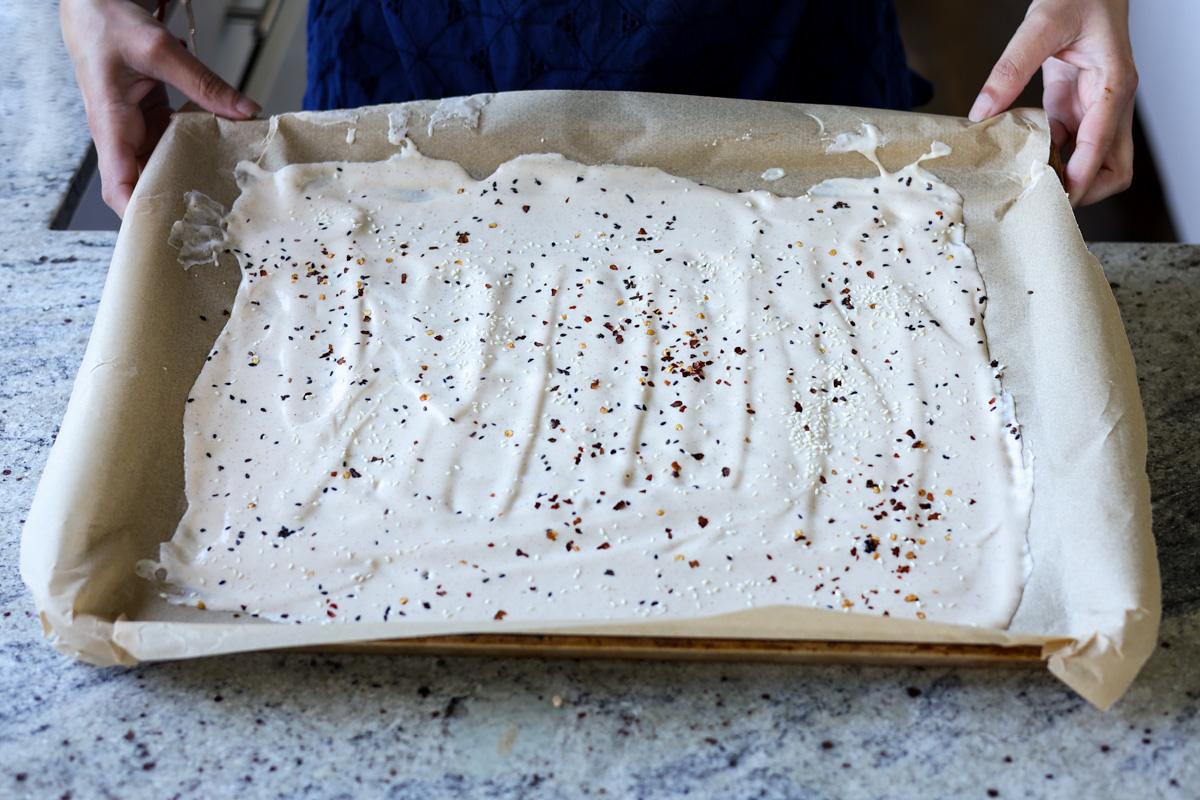 tofu cream spread out and topped with everything bagel seasoning