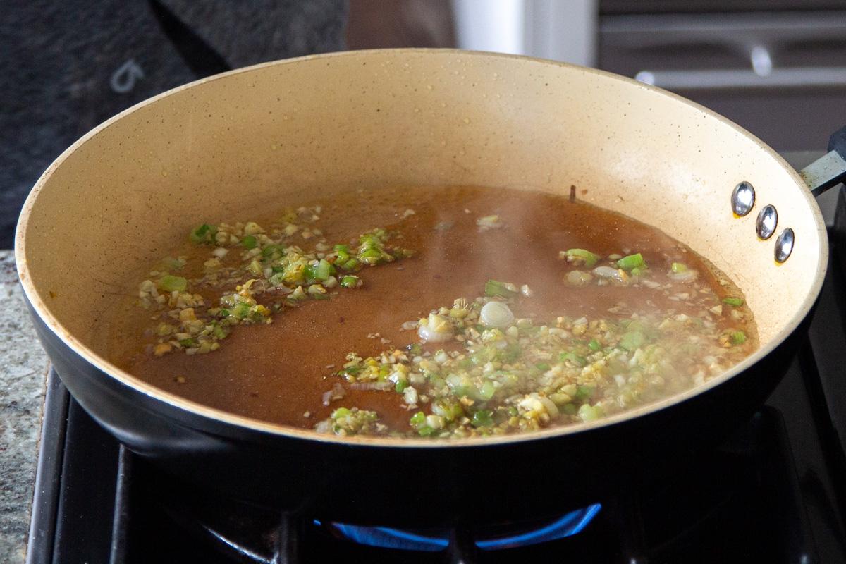 ginger, garlic, and spring onion in the pan, after cooking
