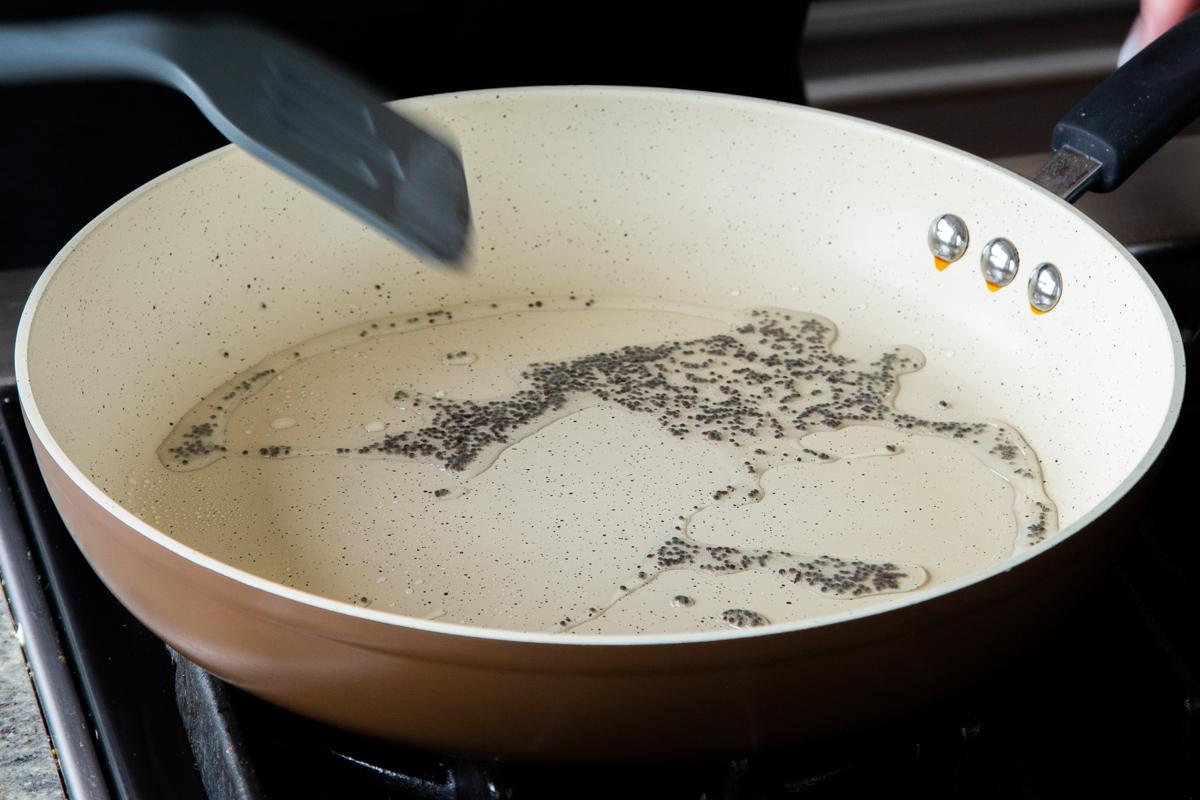 cooked mustard seeds in the pan